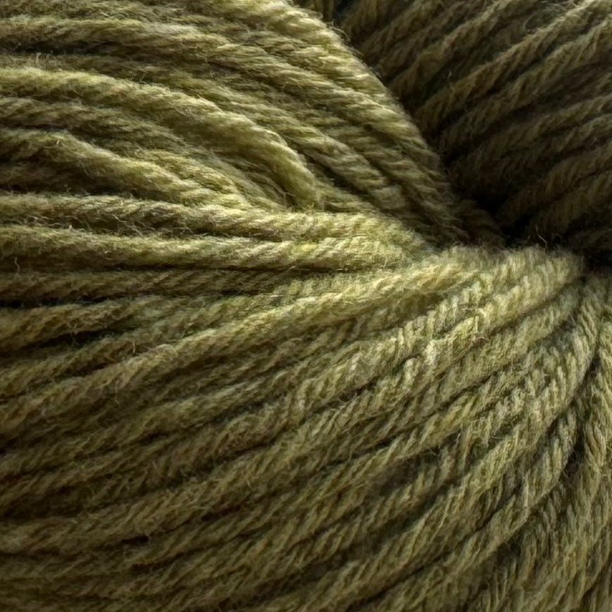 A close-up of twisted yarn strands in a muted olive green color, showing the texture and ply structure of the fiber.